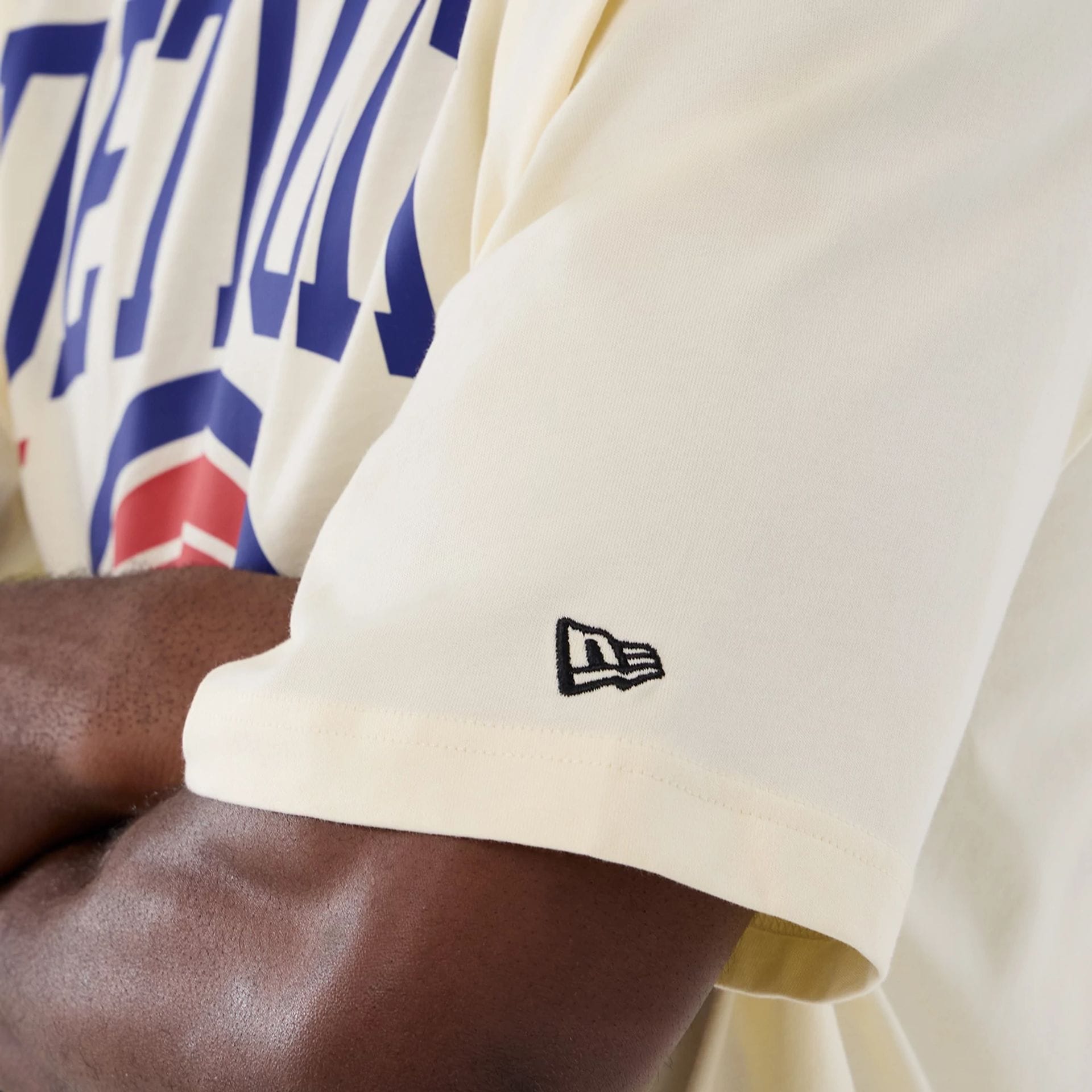 The model is wearing this NBA Hardwood Classic Detroit Pistons T-Shirt in cream. 4