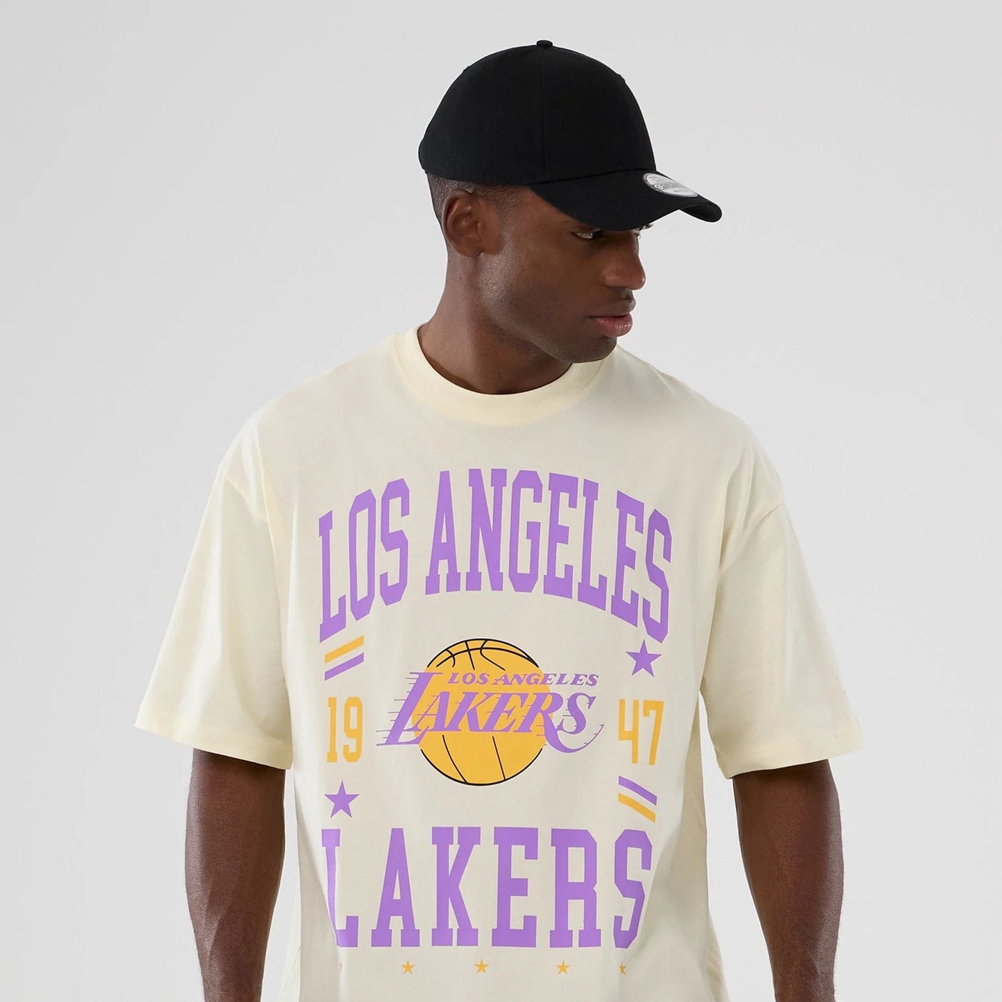 The model is wearing this NBA Hardwood Classic LA Lakers T-Shirt in cream. 6