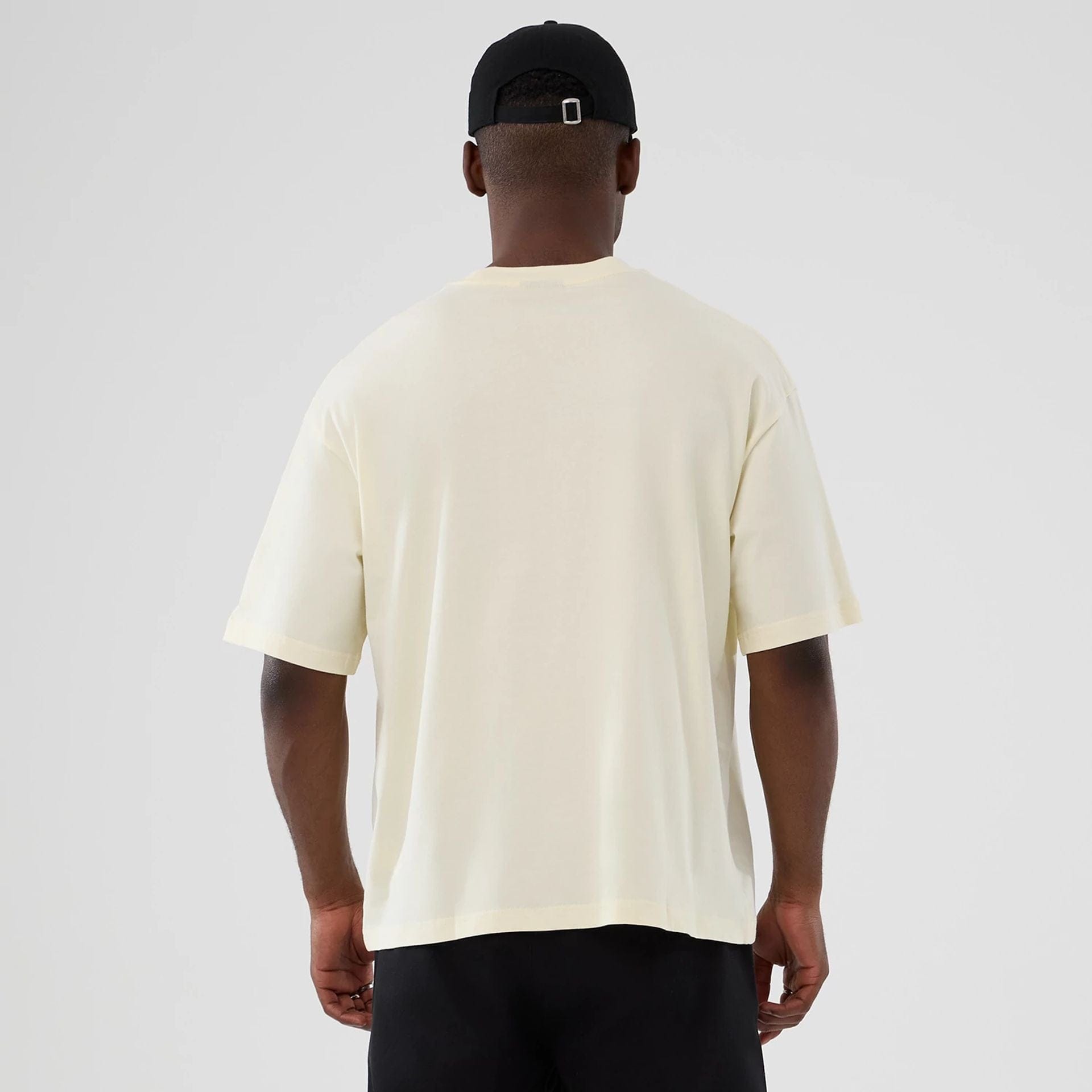 The model is wearing this NBA Hardwood Classic LA Lakers T-Shirt in cream. 2