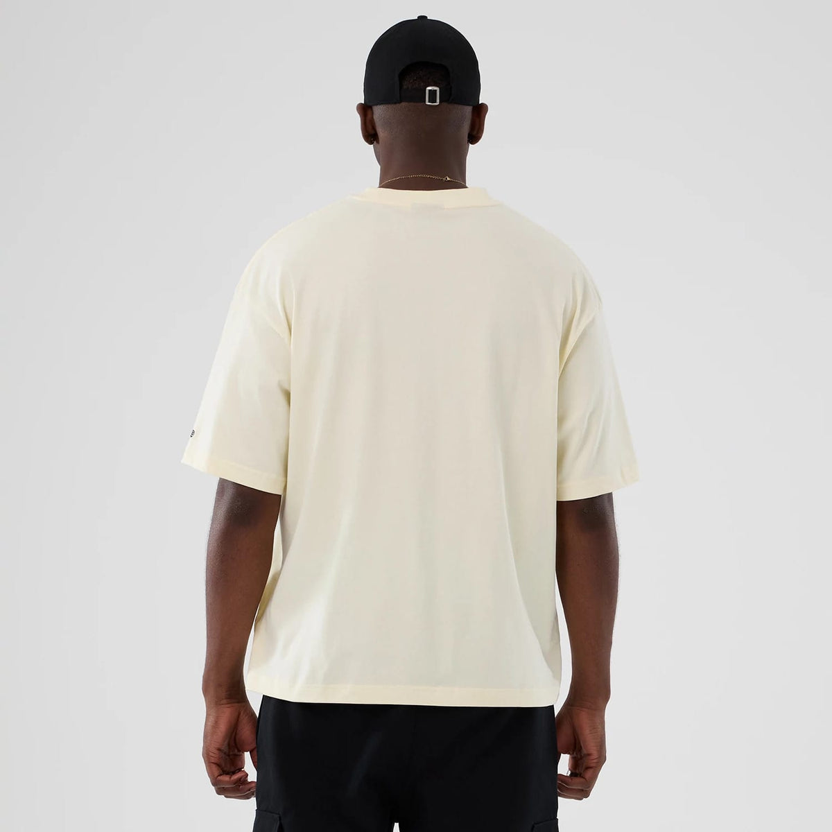 The model is wearing this NBA Hardwood Classic Toronto Raptors T-Shirt in Cream . 2