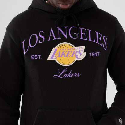 The model is wearing this NBA Hardwood Classic LA Lakers Pullover Hoodie in black. 3