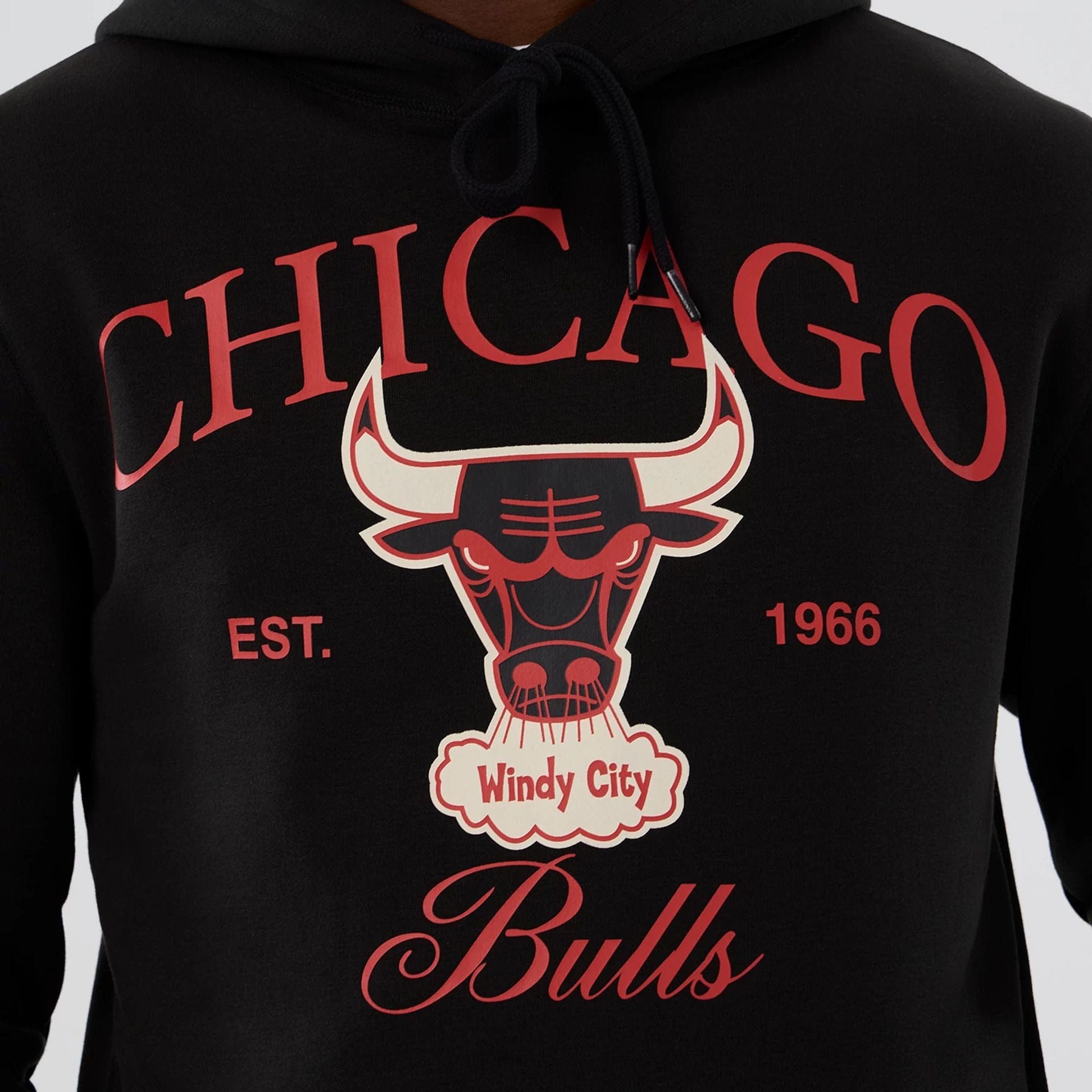The model is wearing this NBA Hardwood Classic Chicago Bulls Pullover Hoodie in black. 7