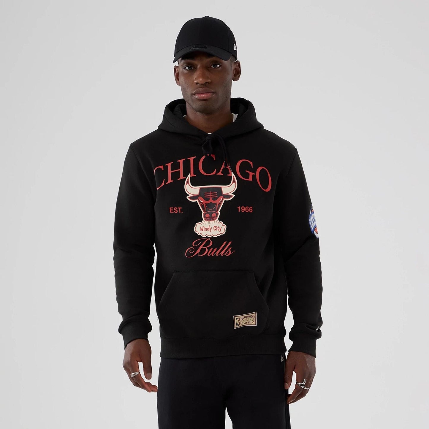 The model is wearing this NBA Hardwood Classic Chicago Bulls Pullover Hoodie in black. 1