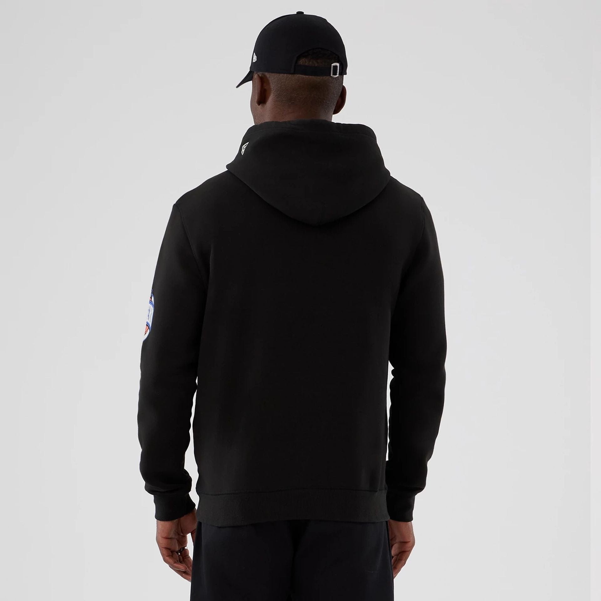 The model is wearing this NBA Hardwood Classic Chicago Bulls Pullover Hoodie in black. 2