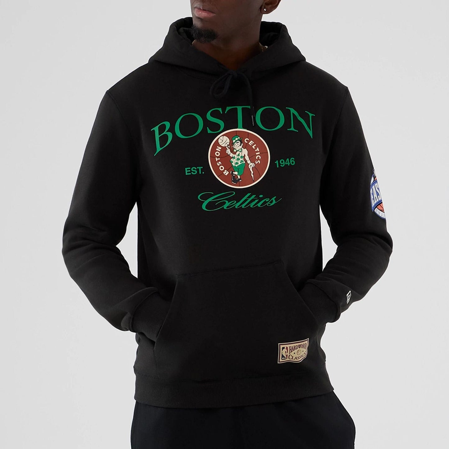 The model is wearing this NBA Hardwood Classic Boston Celtics Pullover Hoodie in black. 7