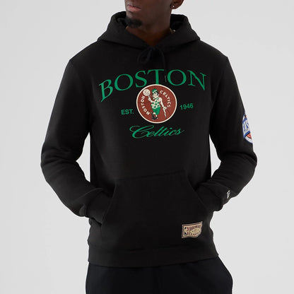 The model is wearing this NBA Hardwood Classic Boston Celtics Pullover Hoodie in black. 7