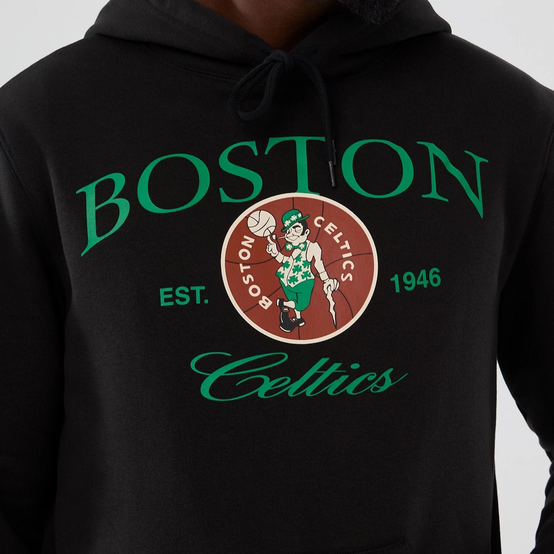 The model is wearing this NBA Hardwood Classic Boston Celtics Pullover Hoodie in black. 3
