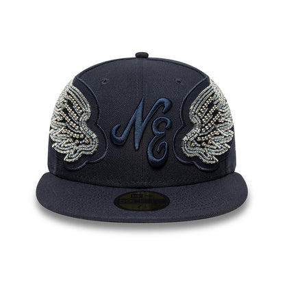 New Era Beaded Wings Navy 59FIFTY Fitted Cap, front view with the raised navy NE logo embroidered on the structured navy crown, surrounded by intricate beaded wing designs, and featuring a gold 59FIFTY size sticker on the visor.