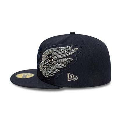 New Era Beaded Wings Navy 59FIFTY Fitted Cap, side view with a detailed beaded wing design on the front panel against a structured navy crown, featuring the New Era flag logo embroidered on the left side and a gold 59FIFTY size sticker on the visor.
