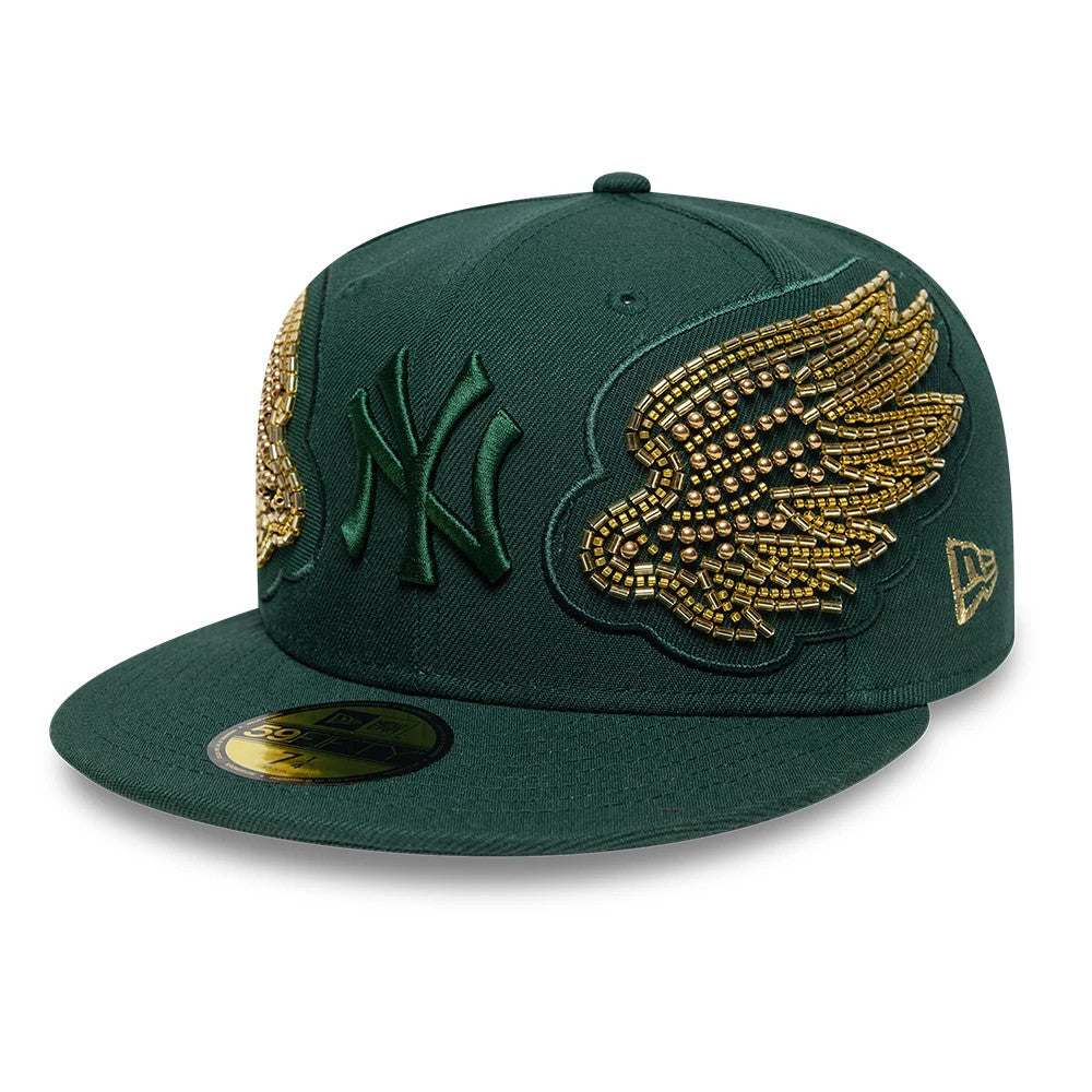 New York Yankees MLB Beaded Wings Dark Green New Era 59FIFTY Fitted Cap, front view showing raised dark green Yankees logo with intricate gold bead wings on the front panels, featuring a gold 59FIFTY size sticker on the flat visor.