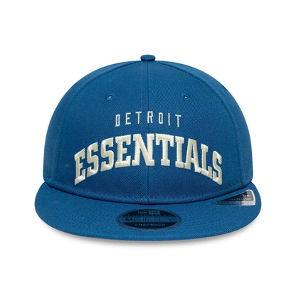 Detroit Lions Fear Of God x NFL Blue Retro Crown New Era 9FIFTY Adjustable Cap, front view showing white raised Detroit Essentials embroidery on the structured blue crown with a black 9FIFTY size sticker on the blue flat visor.
