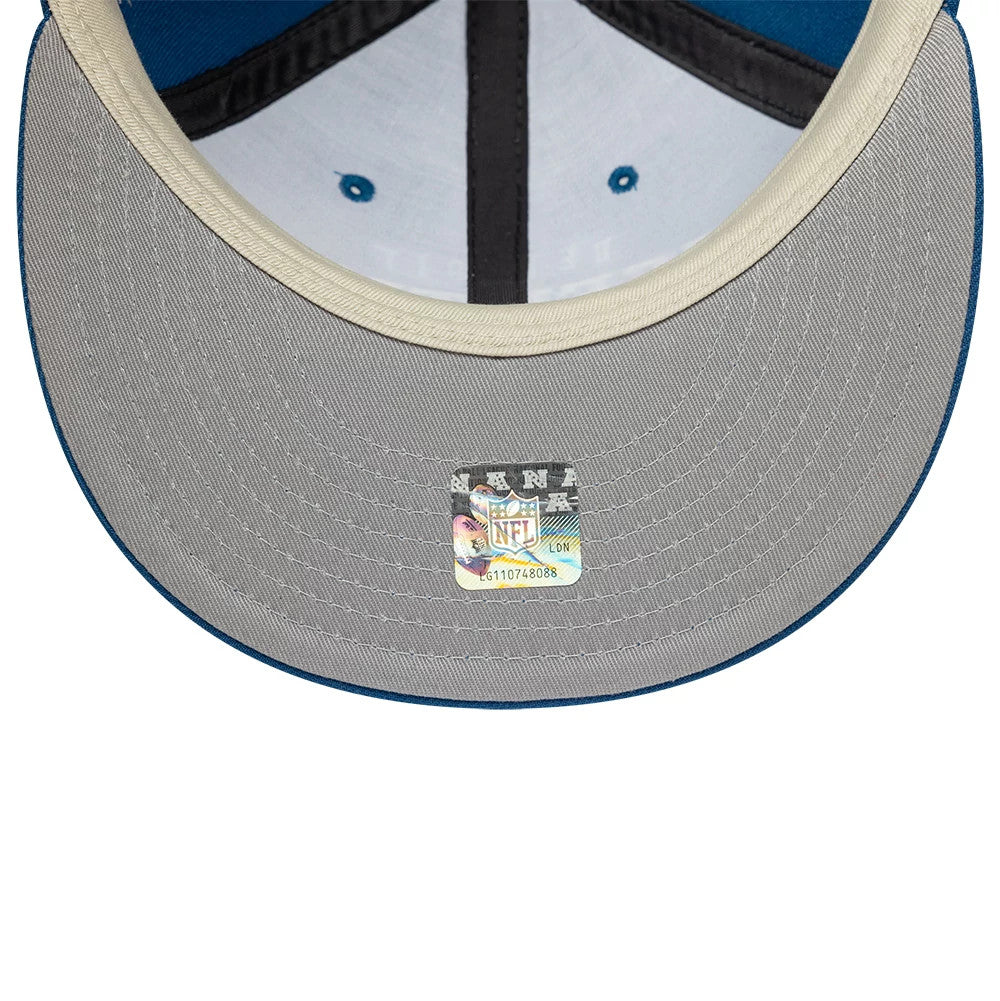 Detroit Lions Fear Of God x NFL Blue Retro Crown New Era 9FIFTY Adjustable Cap, inside view showing a grey undervisor with an NFL authenticity sticker, white taping, and blue eyelets on the structured interior panels.
