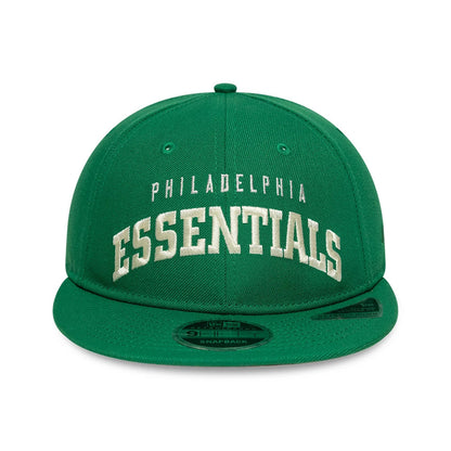 Philadelphia Eagles Fear Of God x NFL Green Retro Crown New Era 9FIFTY Adjustable Cap, front view showing white embroidered Philadelphia Essentials text on the structured green crown, with a flat visor and 9FIFTY size sticker on the visor.