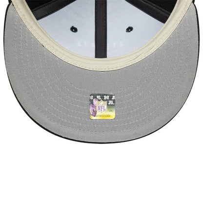 Atlanta Falcons Fear Of God x NFL Black Retro Crown New Era 9FIFTY Adjustable Cap, inside view showing a grey undervisor with a detailed NFL shield sticker and black taping crossing the cap's interior panels.