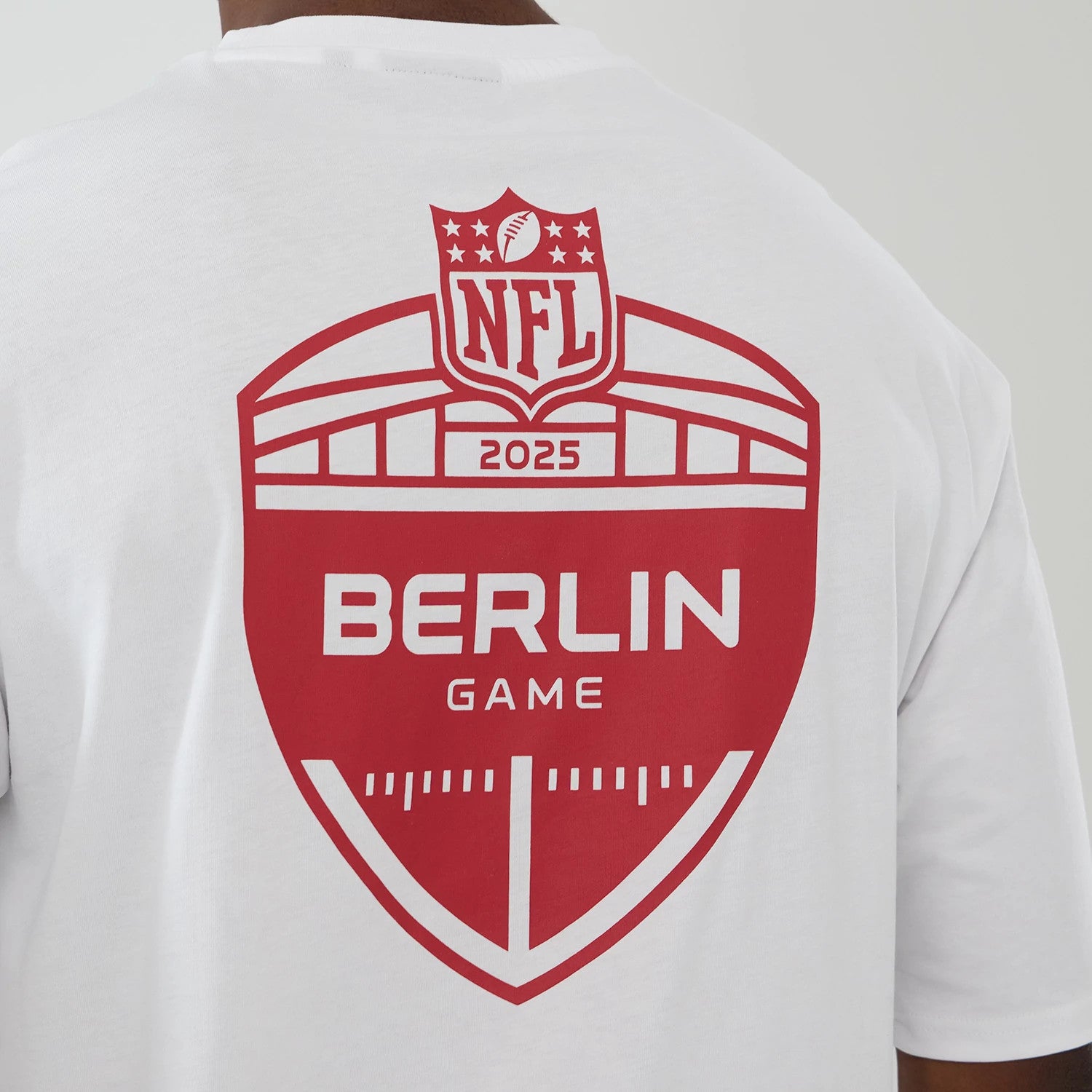 The Male model is wearing Atlanta Falcons NFL International Series Games 2025 White Oversized T-Shirt 5
