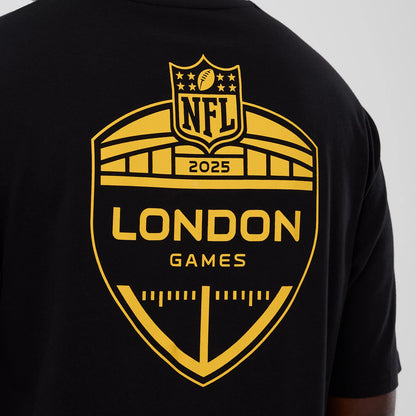 The Male model is wearing Minnesota Vikings NFL International Series Games 2025 Black Oversized T-Shirt 4
