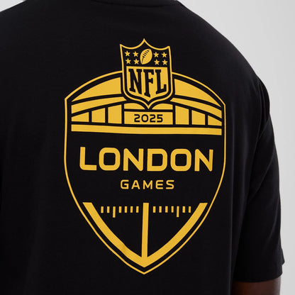 The Male model is wearing Minnesota Vikings NFL International Series Games 2025 Black Oversized T-Shirt 4