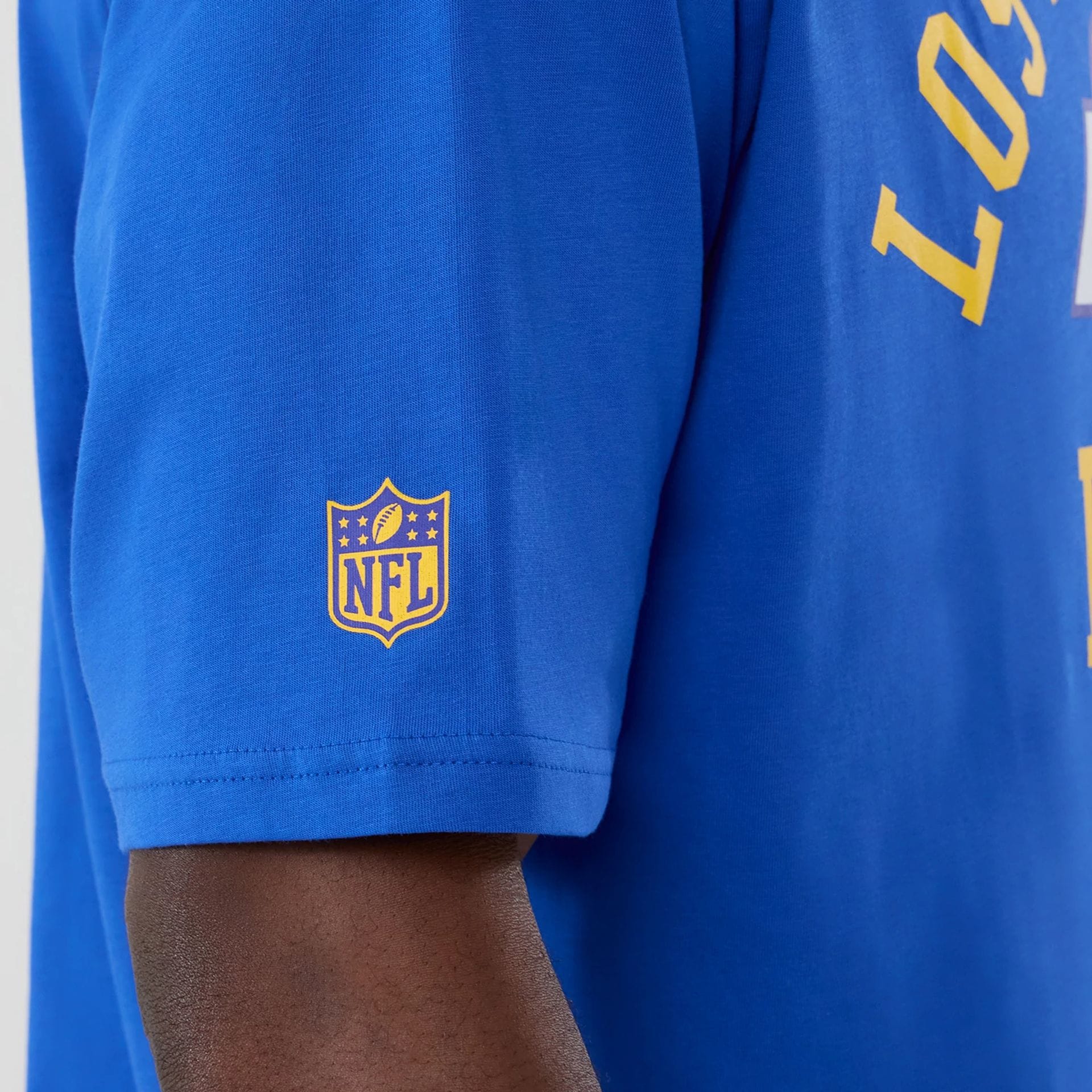 The Male model is wearing LA Rams NFL International Series Games 2025 Bright Blue Oversized T-Shirt 5