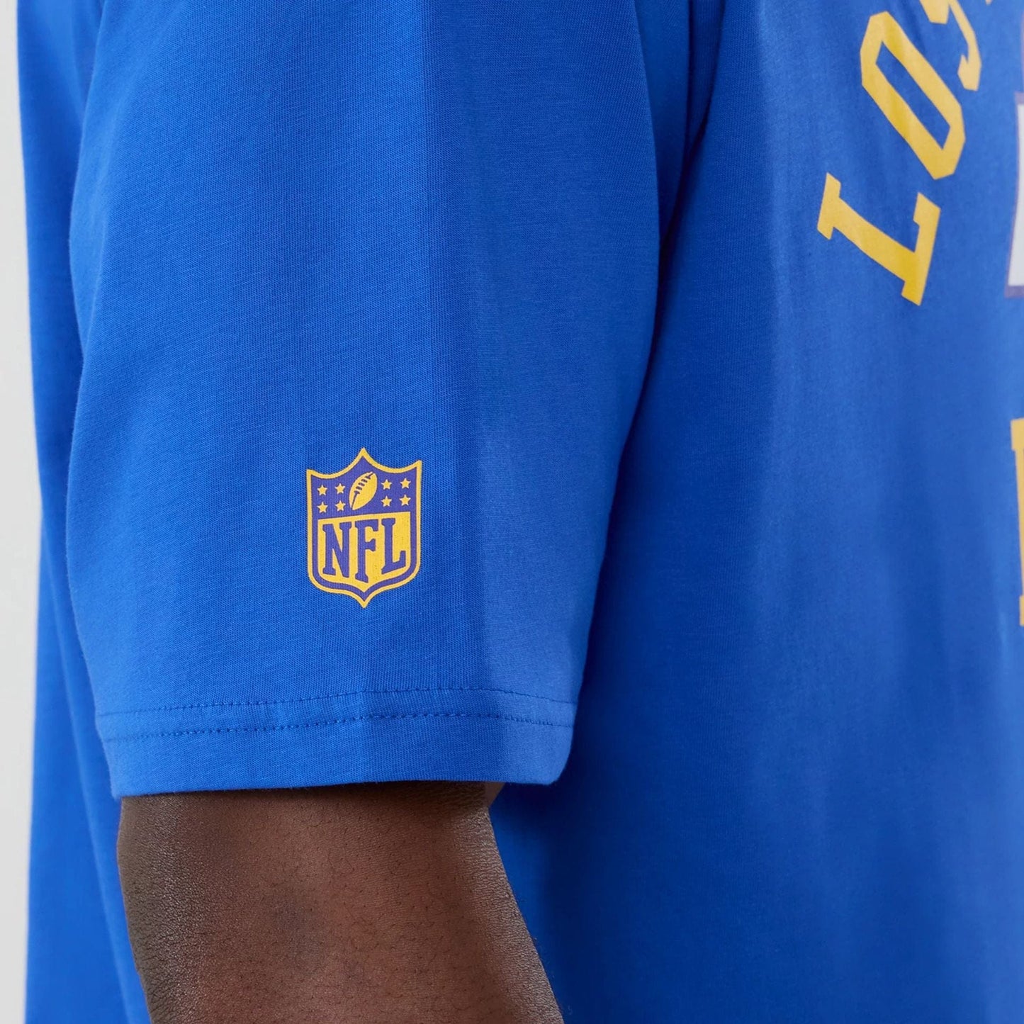 The Male model is wearing LA Rams NFL International Series Games 2025 Bright Blue Oversized T-Shirt  5