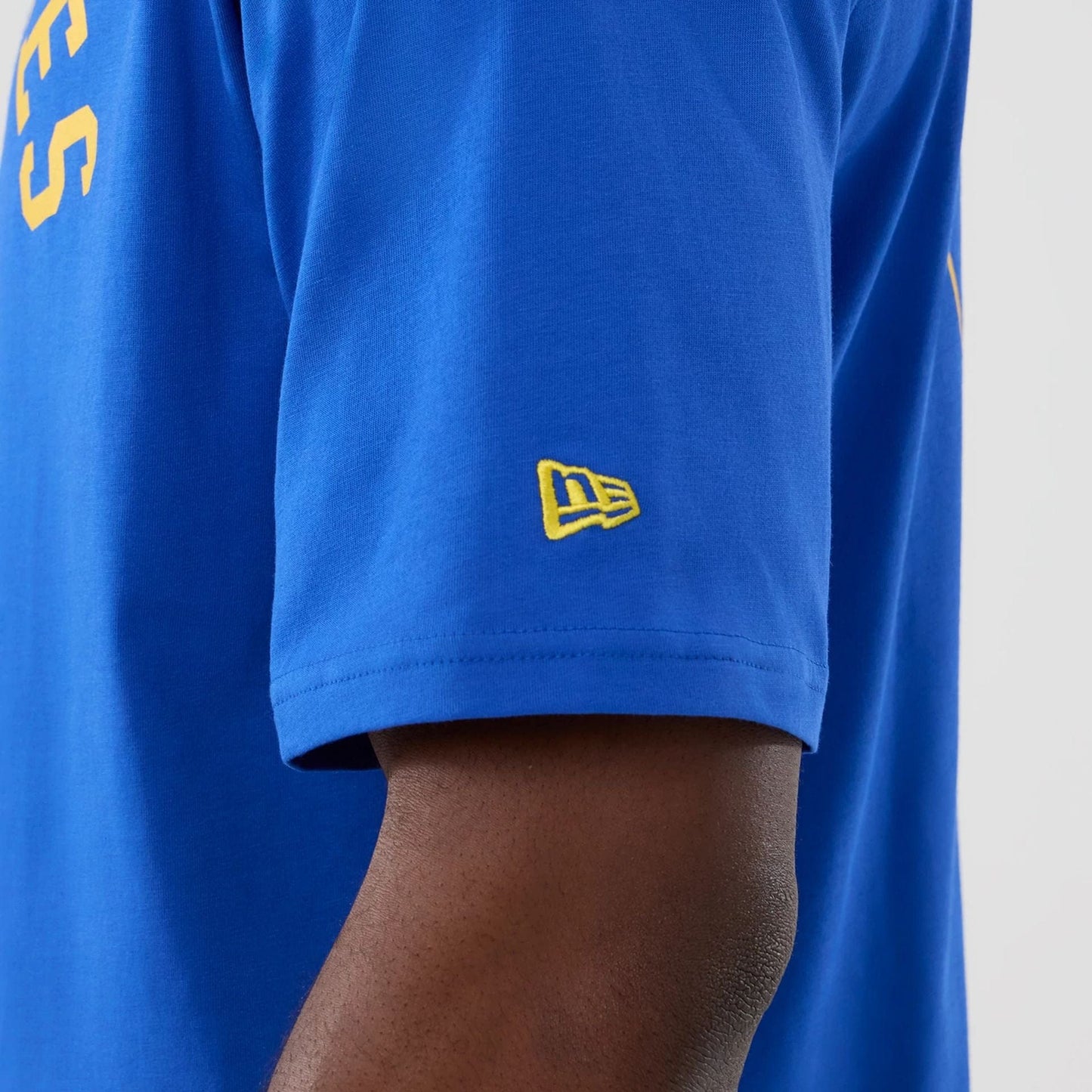 The Male model is wearing LA Rams NFL International Series Games 2025 Bright Blue Oversized T-Shirt  6