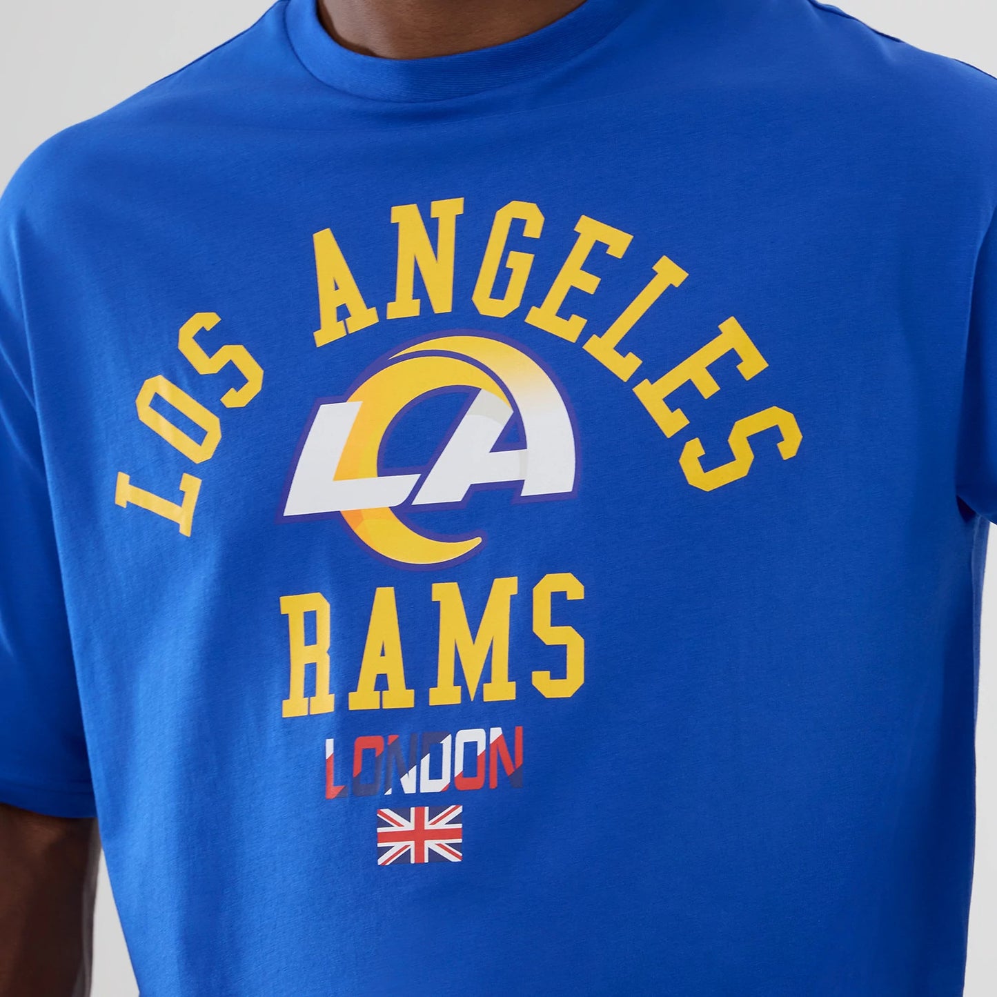 The Male model is wearing LA Rams NFL International Series Games 2025 Bright Blue Oversized T-Shirt 3