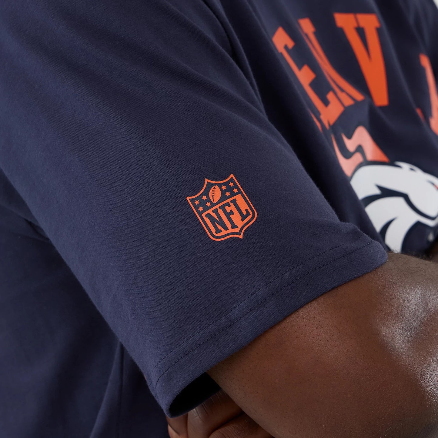 The Male model is wearing Denver Broncos NFL International Series Games 2025 Navy Oversized T-Shirt 5