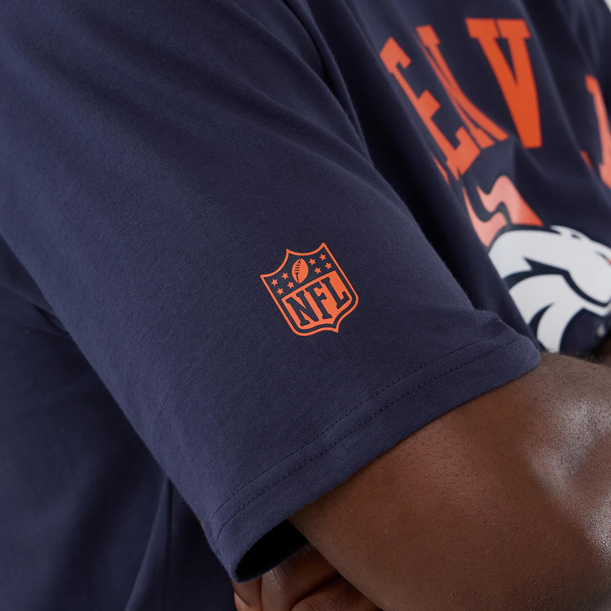 The Male model is wearing Denver Broncos NFL International Series Games 2025 Navy Oversized T-Shirt 5