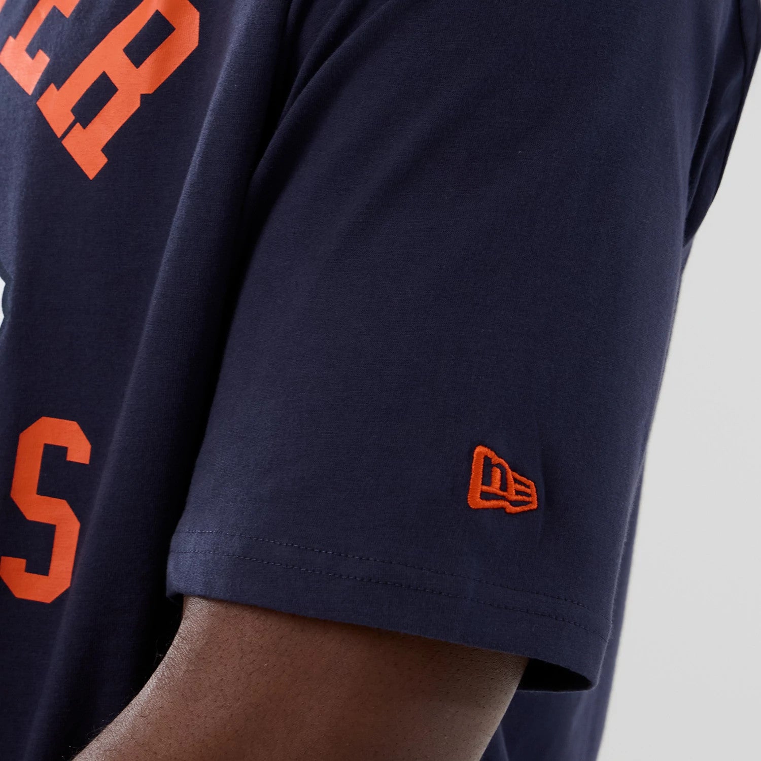 The Male model is wearing Denver Broncos NFL International Series Games 2025 Navy Oversized T-Shirt 6