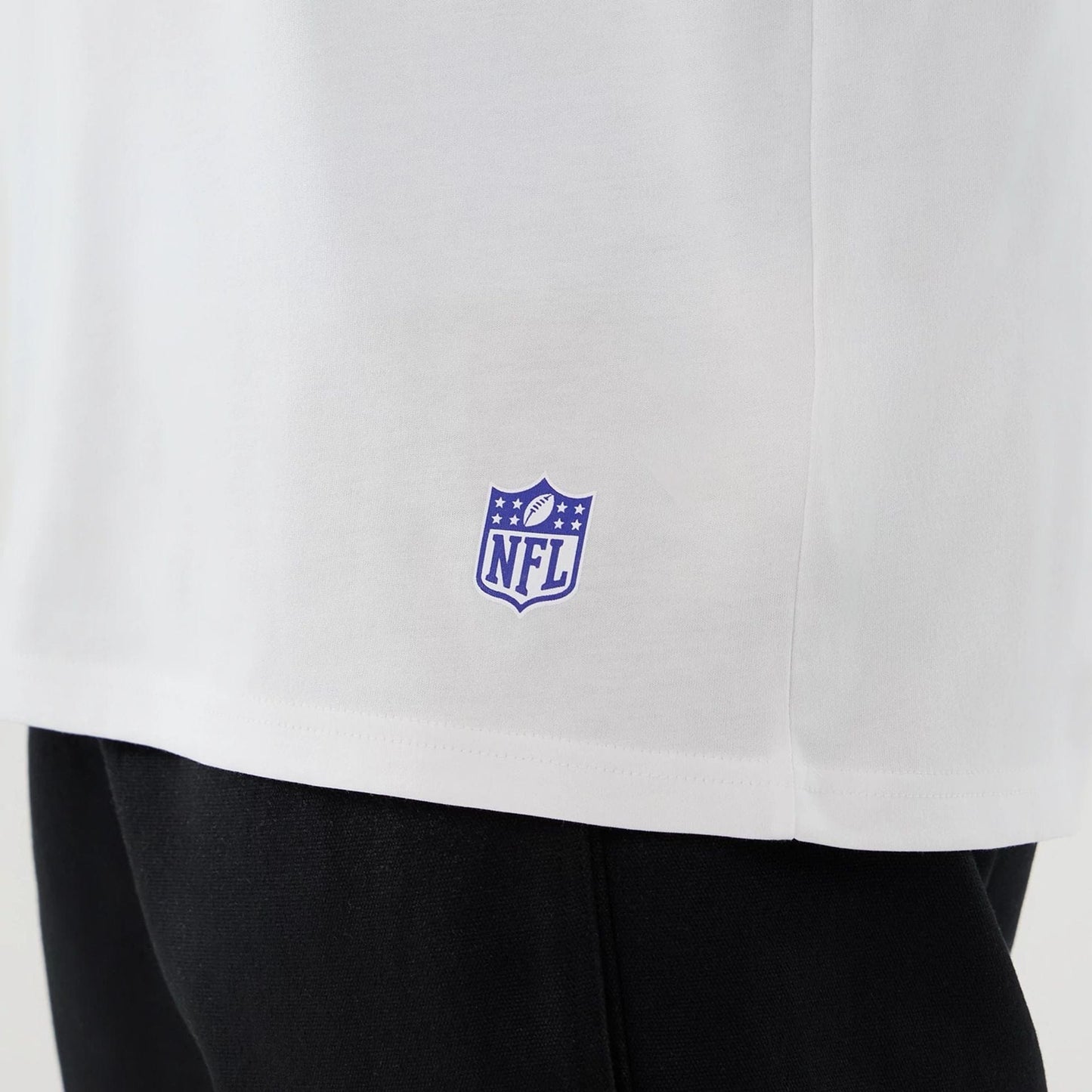 The Male model is wearing LA Rams NFL International Series Games 2025 White Oversized T-Shirt  5