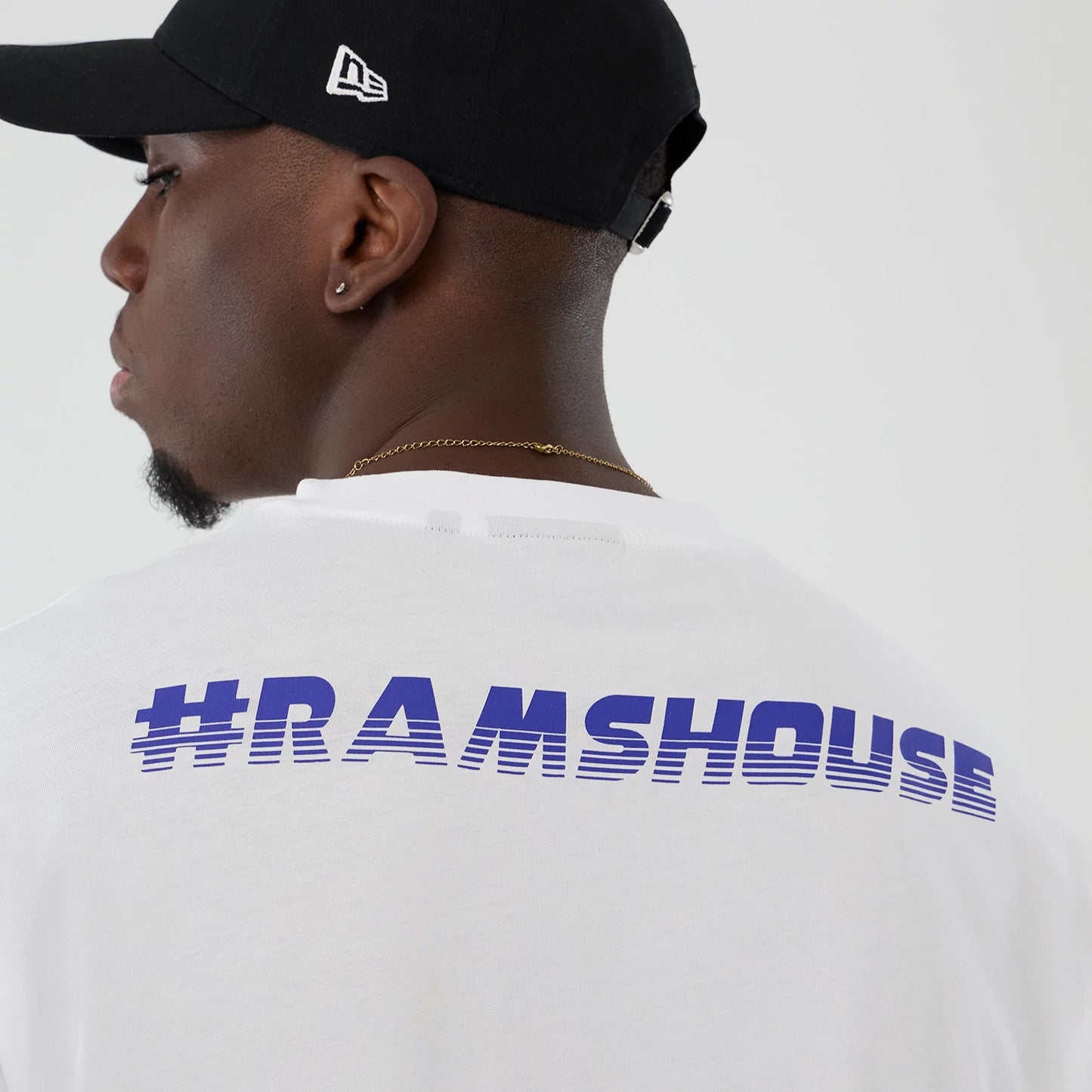The Male model is wearing LA Rams NFL International Series Games 2025 White Oversized T-Shirt 6