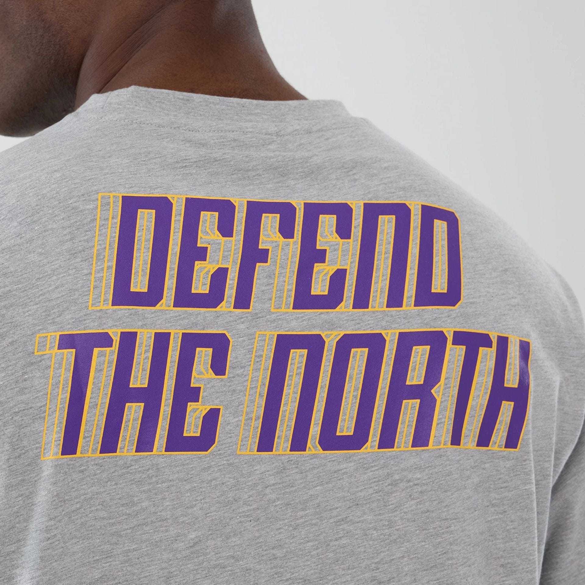 The Male model is wearing Minnesota Vikings NFL International Series Games 2025 Grey Oversized T-Shirt  5