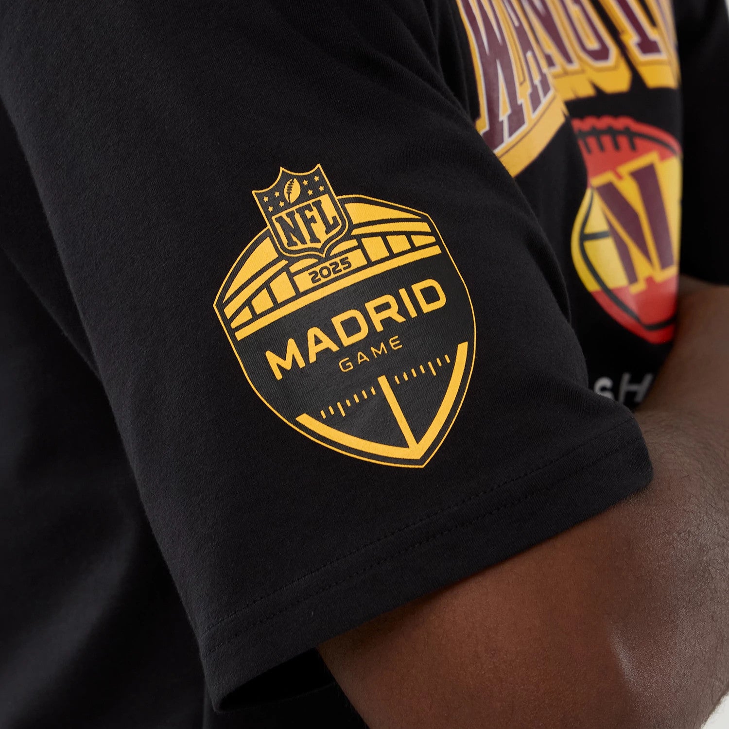 The Male model is wearing Washington Commanders Script NFL International Series Games 2025 Black Oversized T-Shirt 3