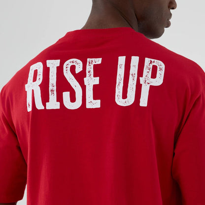 The Male model is wearing Atlanta Falcons NFL International Series Games 2025 Red Oversized T-Shirt  5