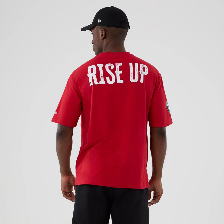 The Male model is wearing Atlanta Falcons NFL International Series Games 2025 Red Oversized T-Shirt  2
