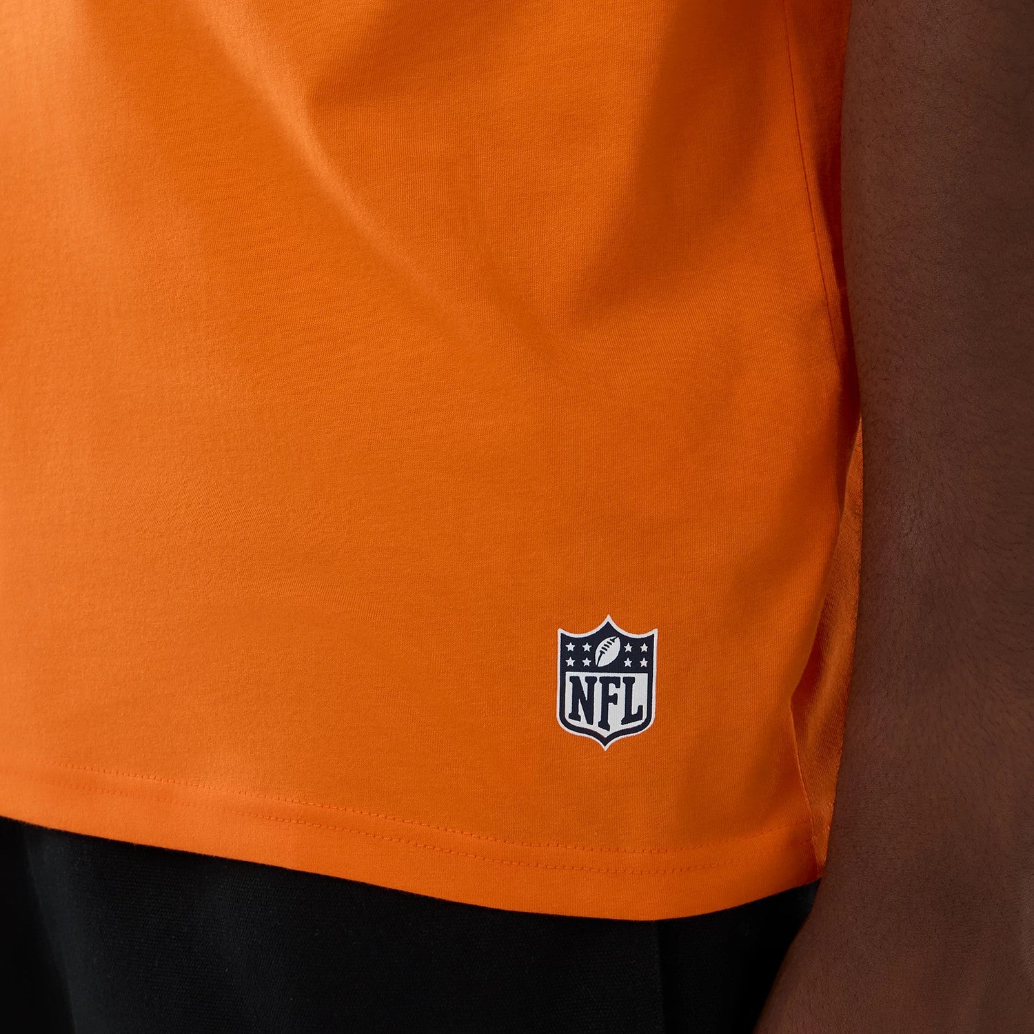 The Male model is wearing Denver Broncos NFL International Series Games 2025 Orange Oversized T-Shirt 5