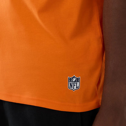 The Male model is wearing Denver Broncos NFL International Series Games 2025 Orange Oversized T-Shirt  5