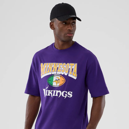 The Male model is wearing Minnesota Vikings NFL International Series Games 2025 Purple Oversized T-Shirt 3