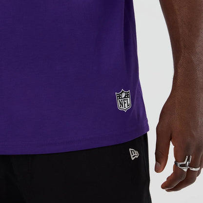 The Male model is wearing Minnesota Vikings NFL International Series Games 2025 Purple Oversized T-Shirt  5