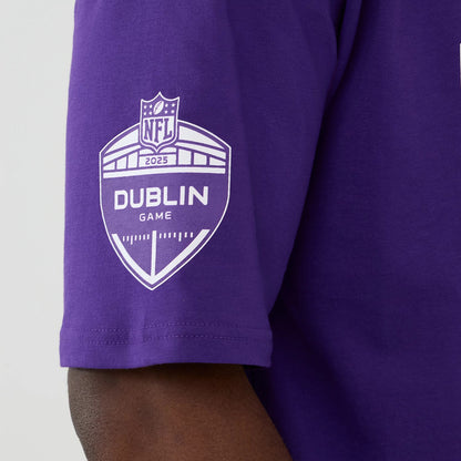 The Male model is wearing Minnesota Vikings NFL International Series Games 2025 Purple Oversized T-Shirt 4