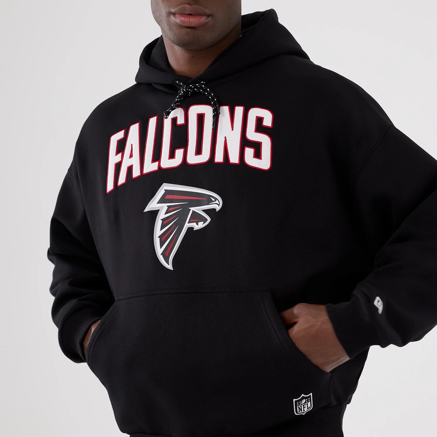The Male model is wearing Atlanta Falcons NFL International Series Games 2025 Black Premium Pullover Hoodie 3