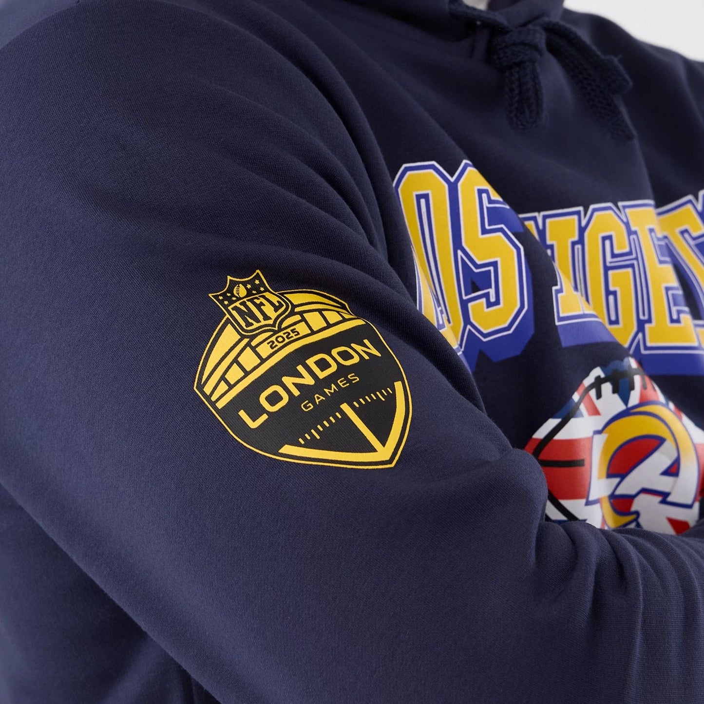 The Male model is wearing LA Rams NFL International Series Games 2025 Navy Pullover Hoodie  5