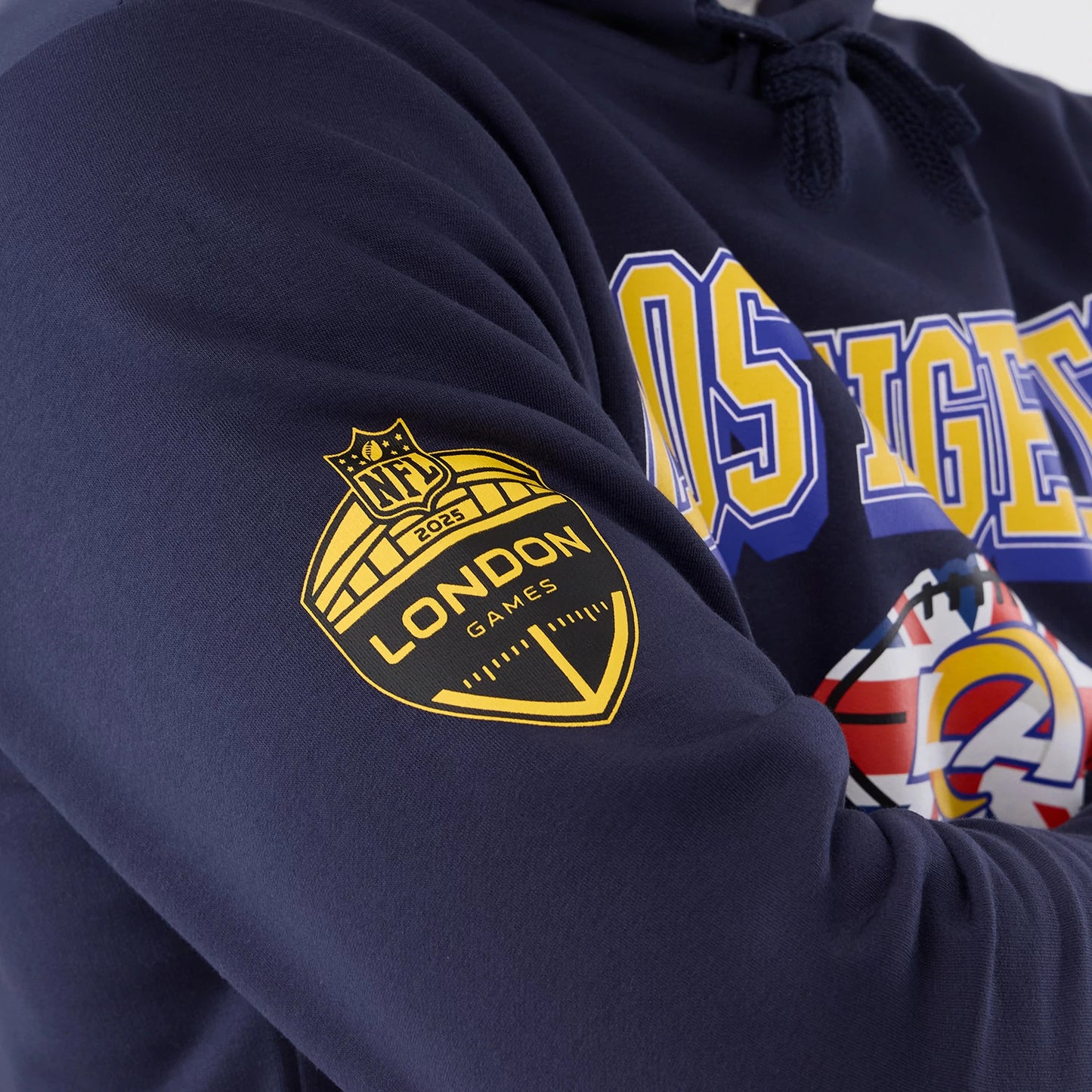 The Male model is wearing LA Rams NFL International Series Games 2025 Navy Pullover Hoodie 5
