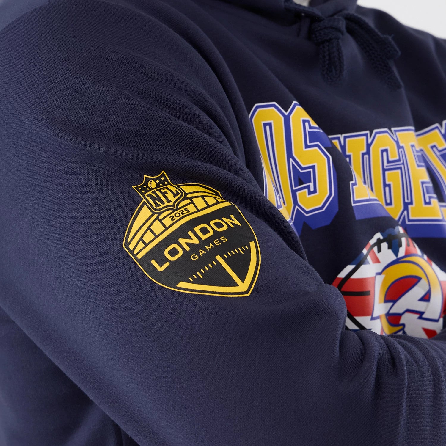 The Male model is wearing LA Rams NFL International Series Games 2025 Navy Pullover Hoodie 5
