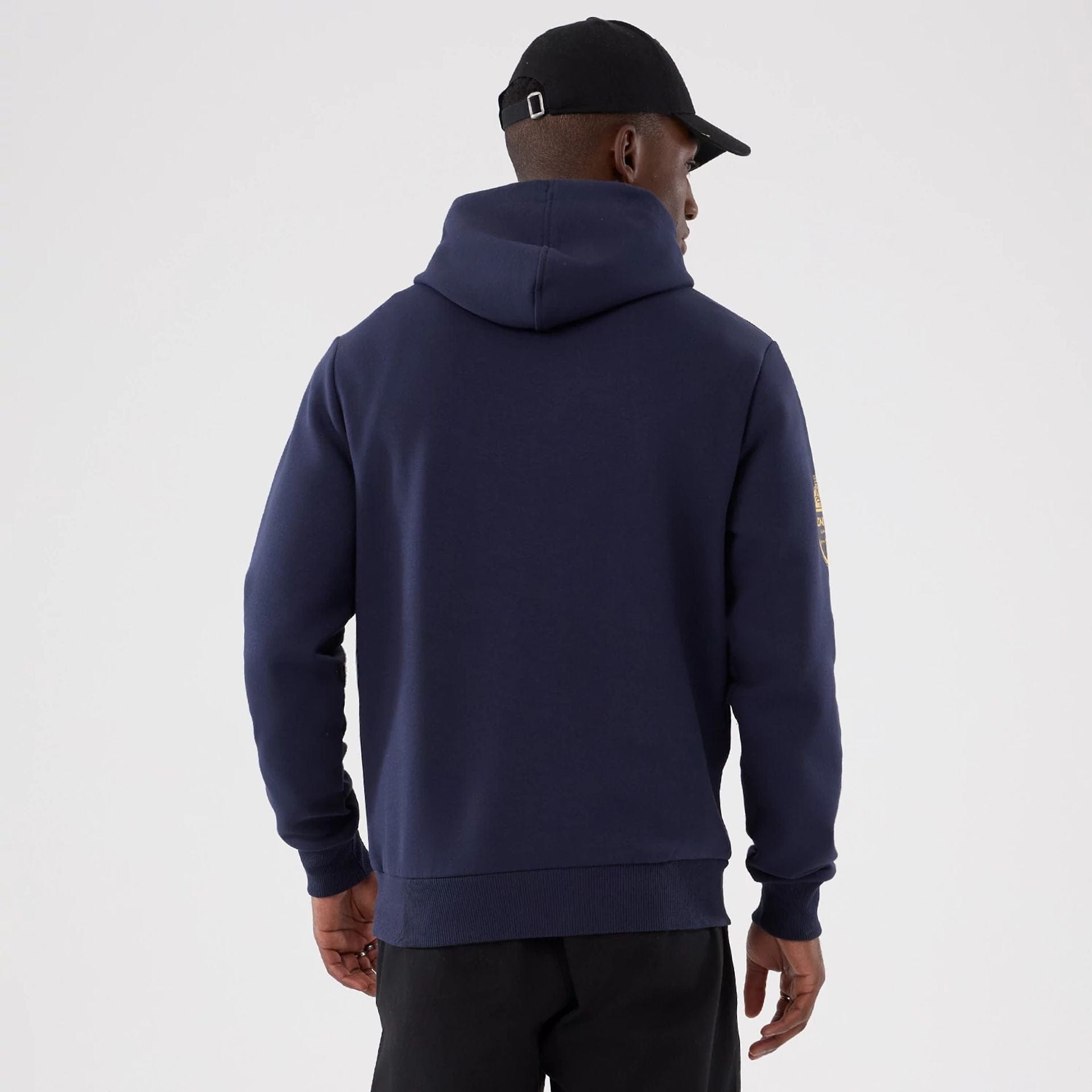 The Male model is wearing LA Rams NFL International Series Games 2025 Navy Pullover Hoodie  2