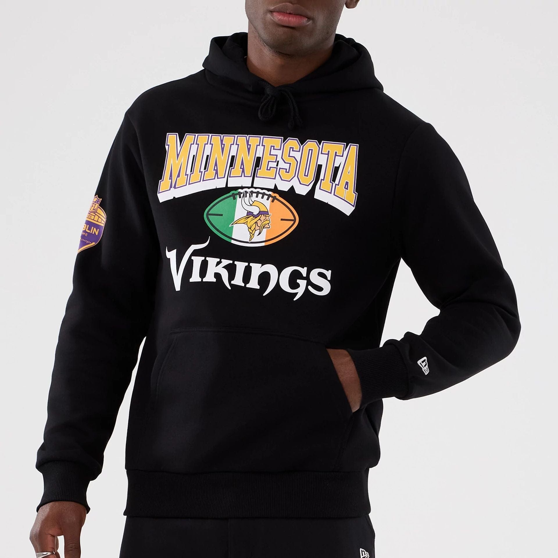 The Male model is wearing Minnesota Vikings NFL International Series Games 2025 Black Pullover Hoodie  7