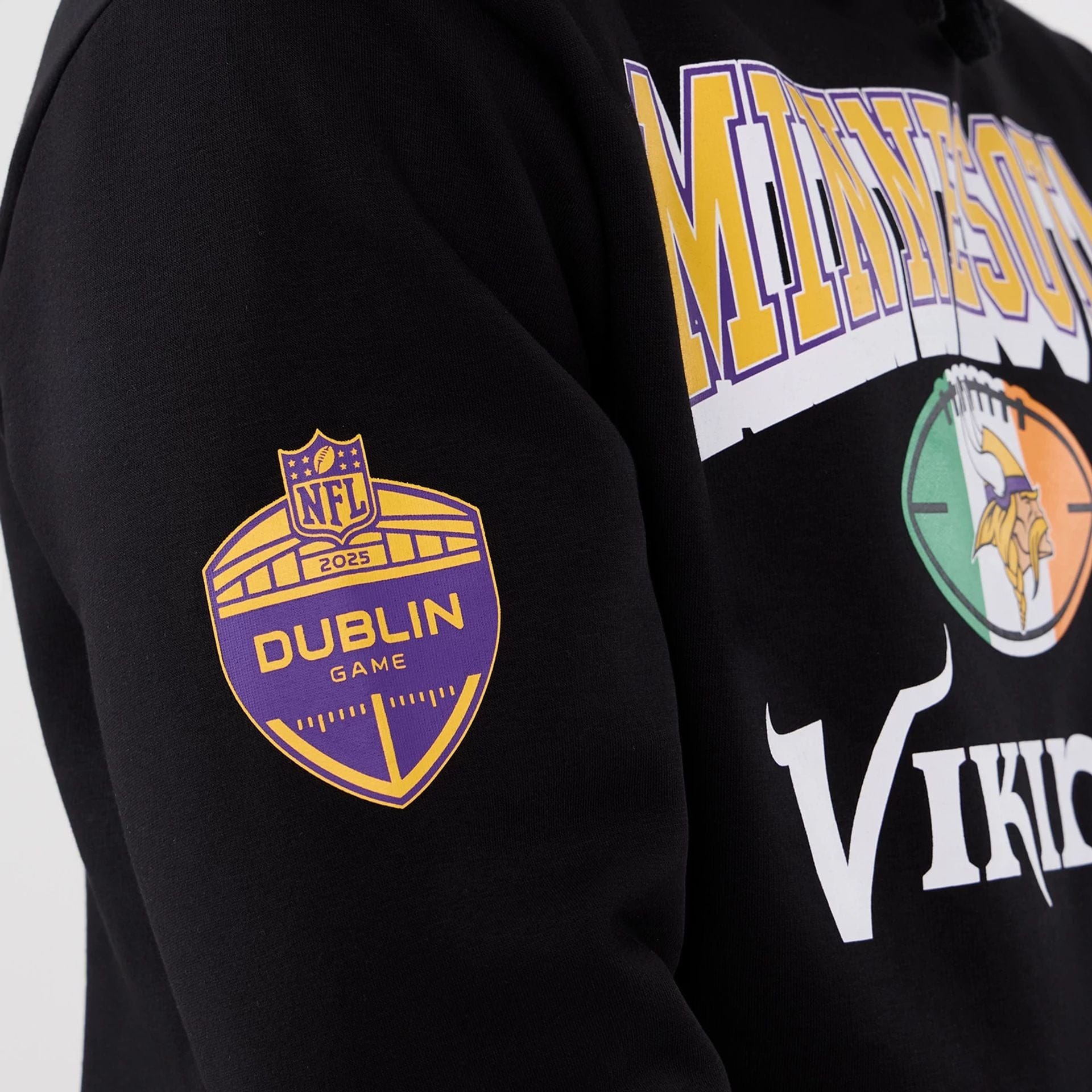 The Male model is wearing Minnesota Vikings NFL International Series Games 2025 Black Pullover Hoodie  5