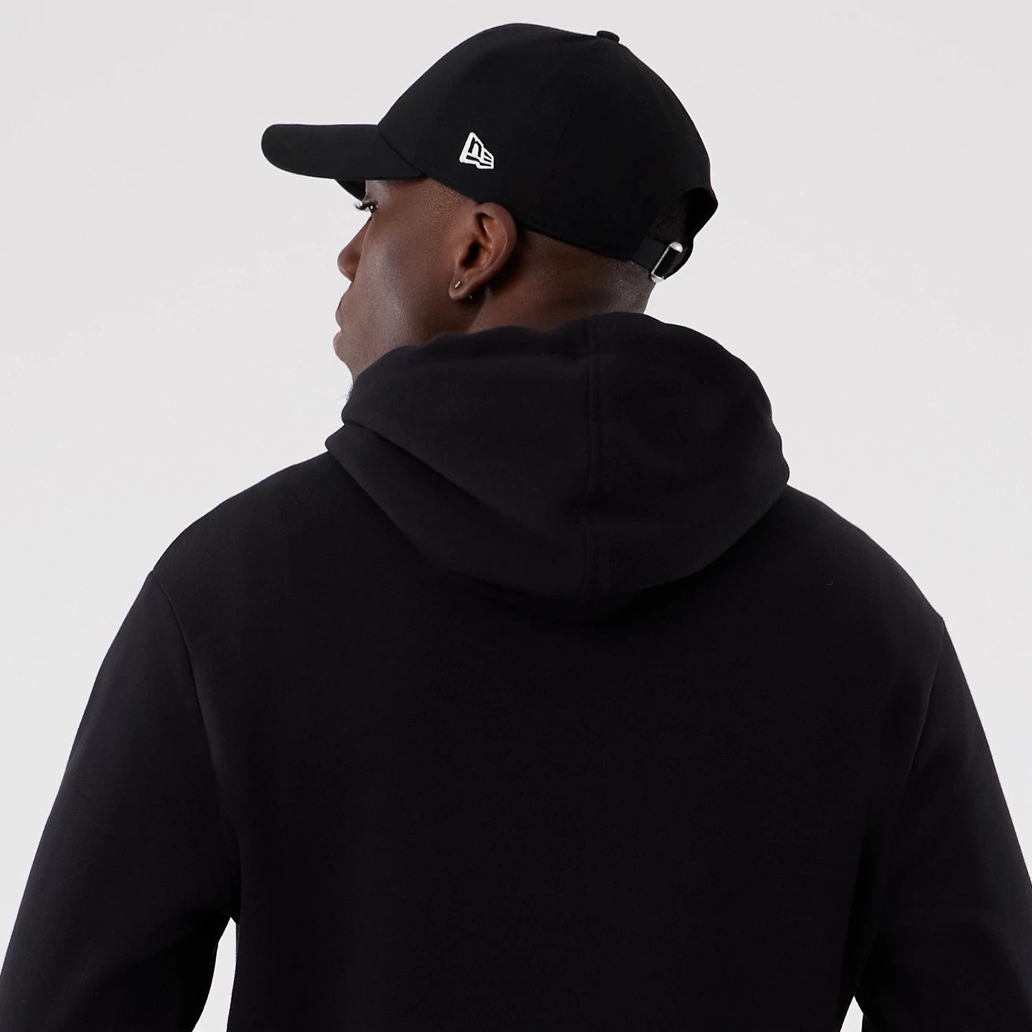 The Male model is wearing Washington Commanders NFL International Series Games 2025 Black Pullover Hoodie 6