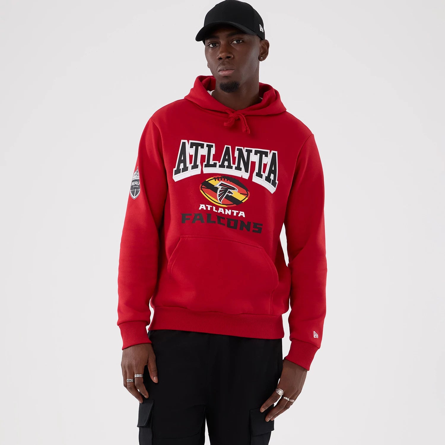 The Male model is wearing Atlanta Falcons NFL International Series Games 2025 Red Pullover Hoodie 1