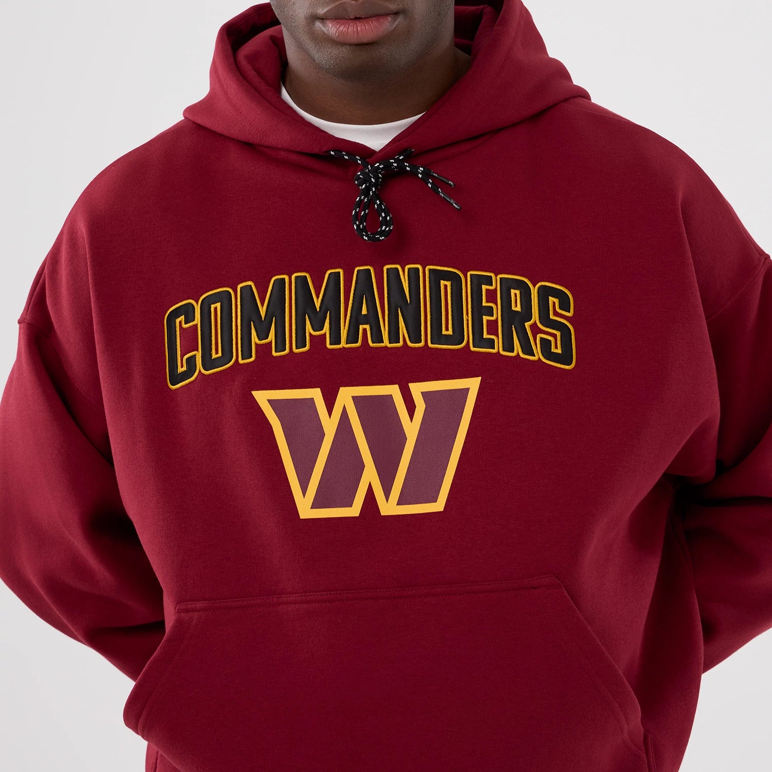 The Male model is wearing Washington Commanders NFL International Series Games 2025 Dark Red Premium Pullover Hoodie 3