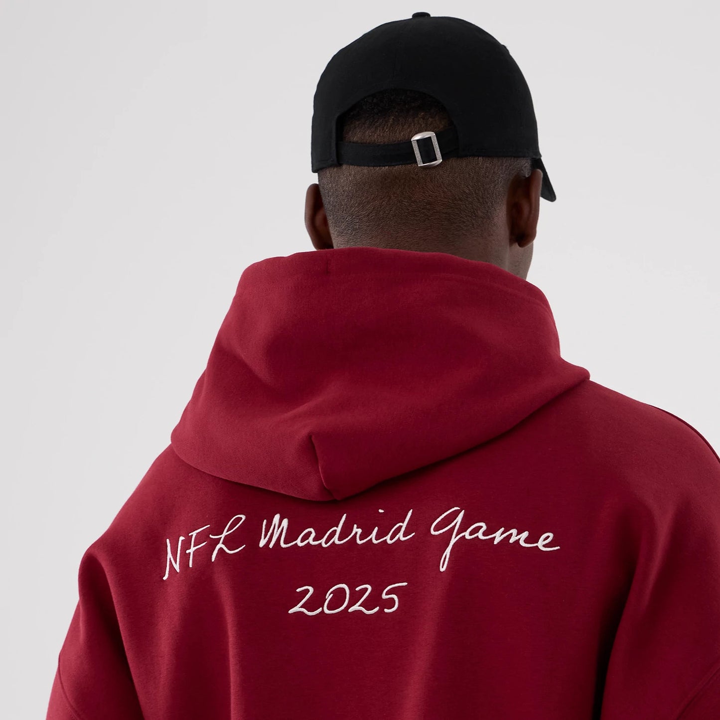 The Male model is wearing Washington Commanders NFL International Series Games 2025 Dark Red Premium Pullover Hoodie 6